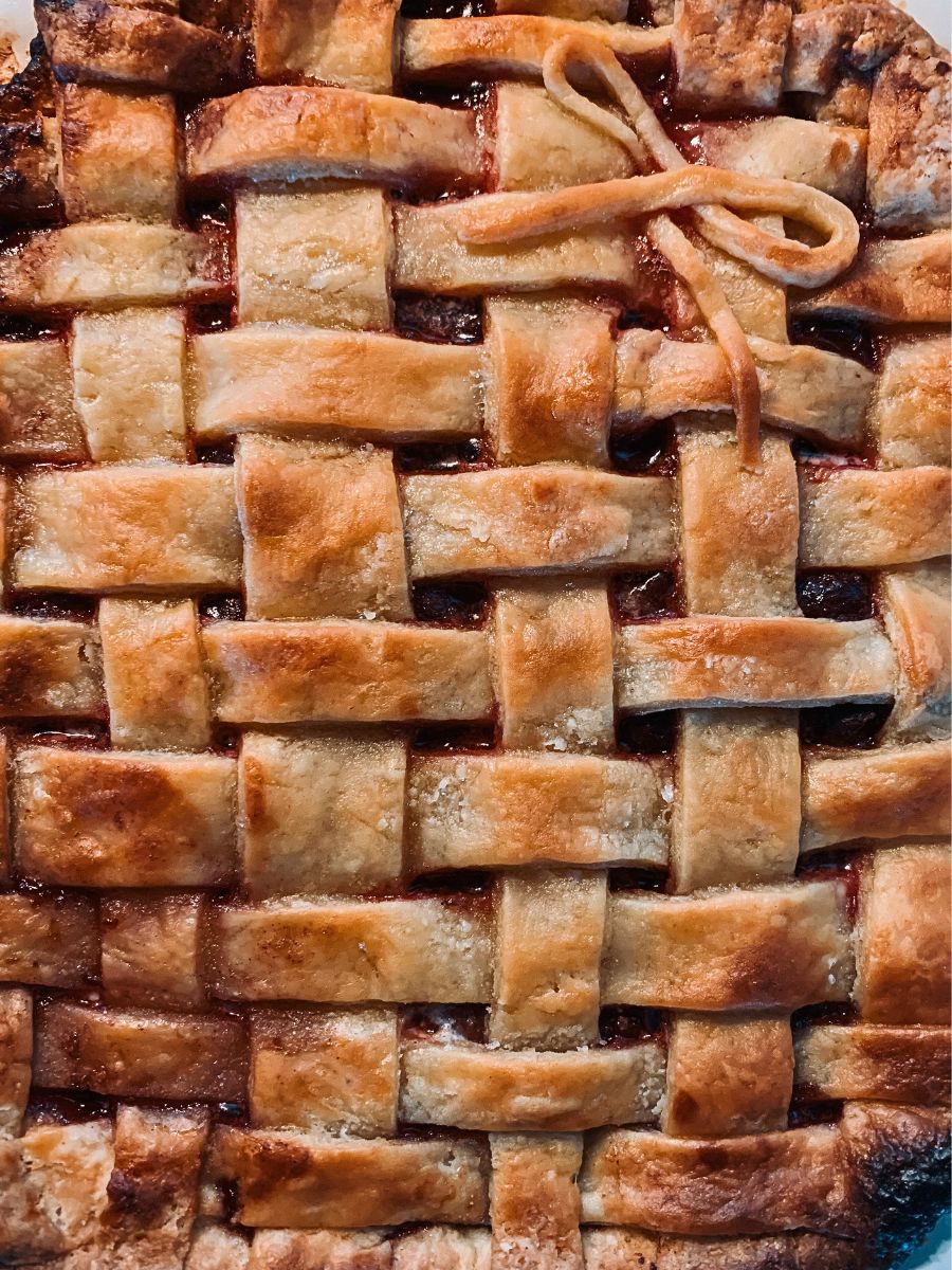 Baked lattice decorated cherry pie crust