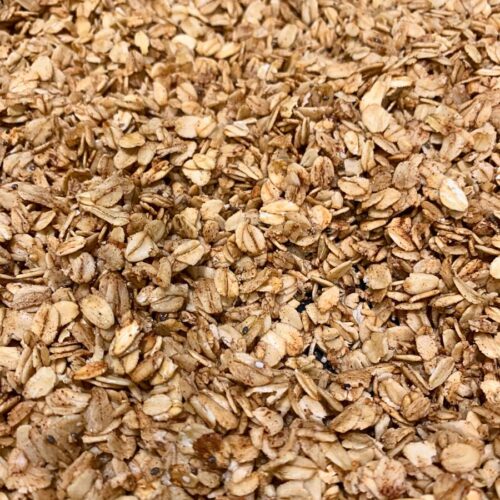 Homemade granola toasted in a cast iron skillet.