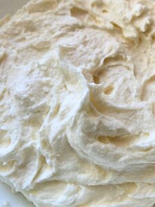 Whipped tallow moisturizer in a facial product jar.