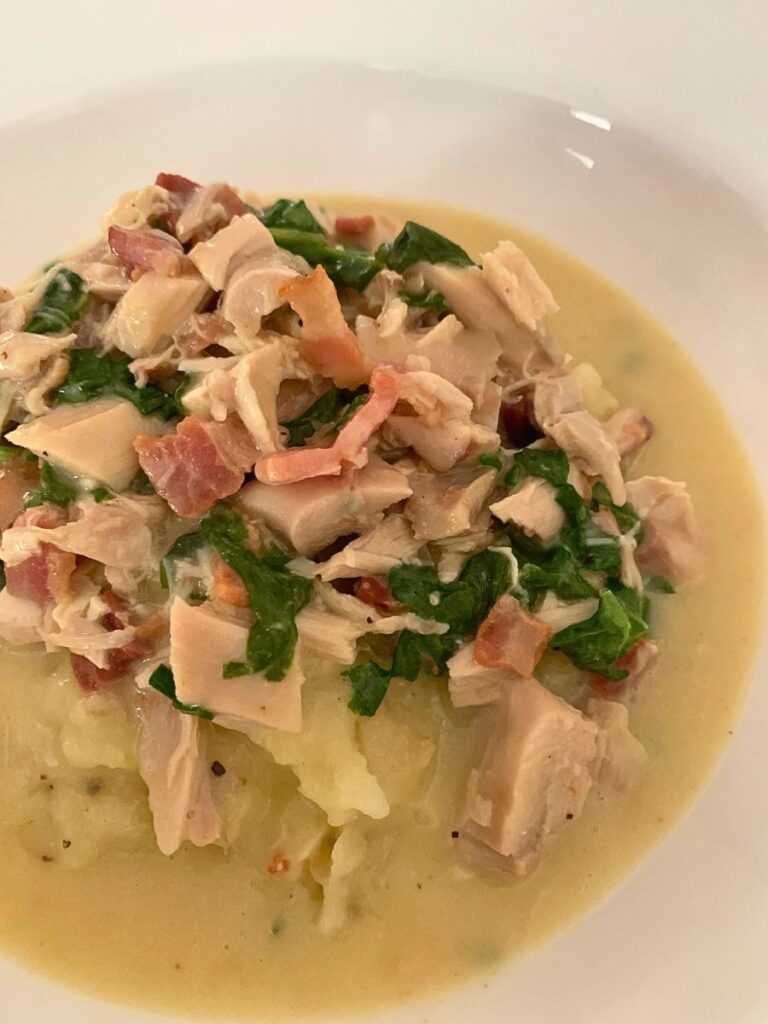 June family dinner shredded roasted chicken in a cream sauce over mashed potatoes