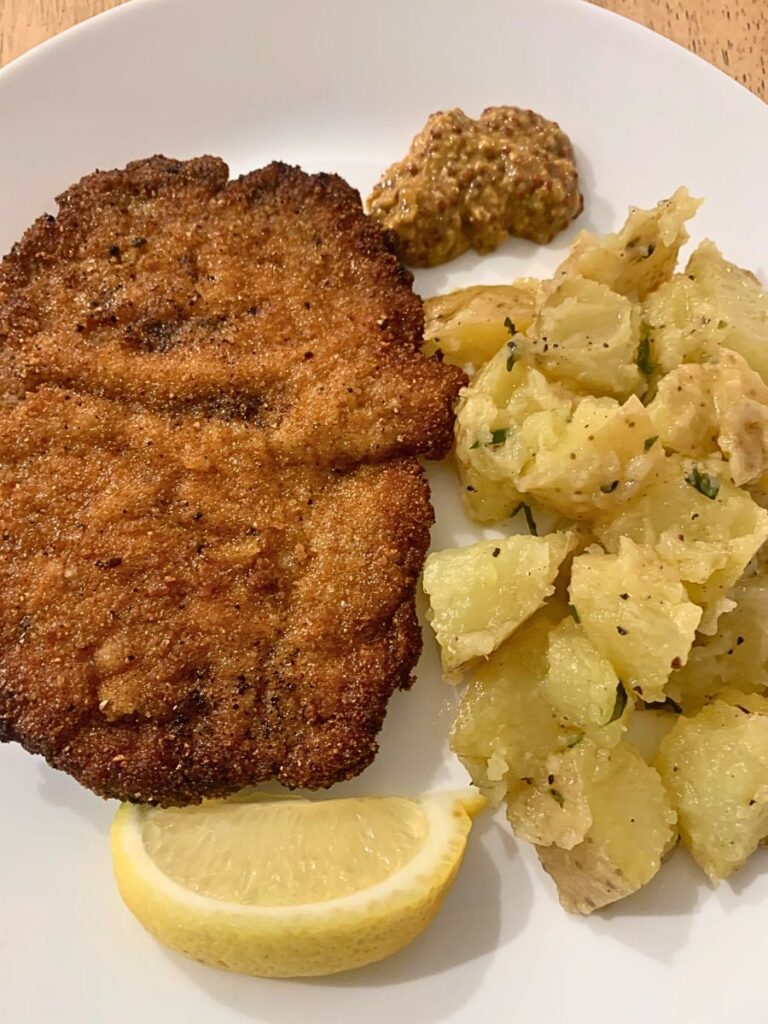 homemade pork schnitzel with chicken broth mashed potatoes for June meal plan. 