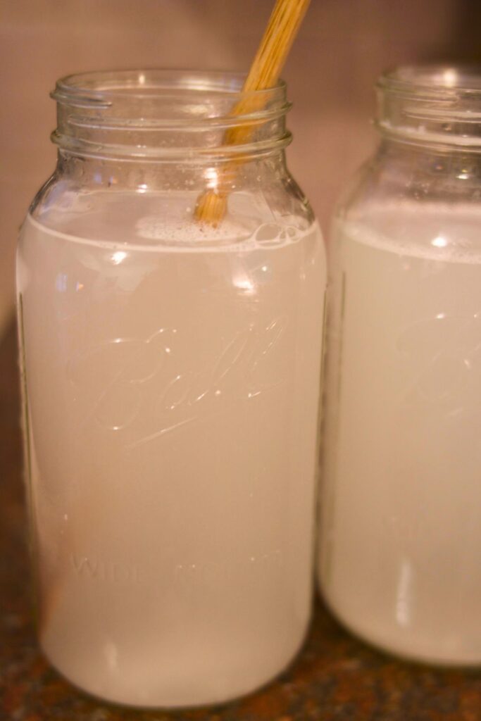 Jar of DIY laundry detergent made from bar soap with simple ingredients