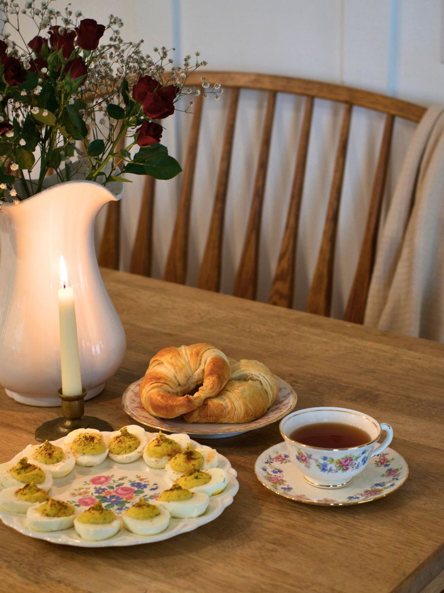 mis matched vintage china displayed on a kitchen table